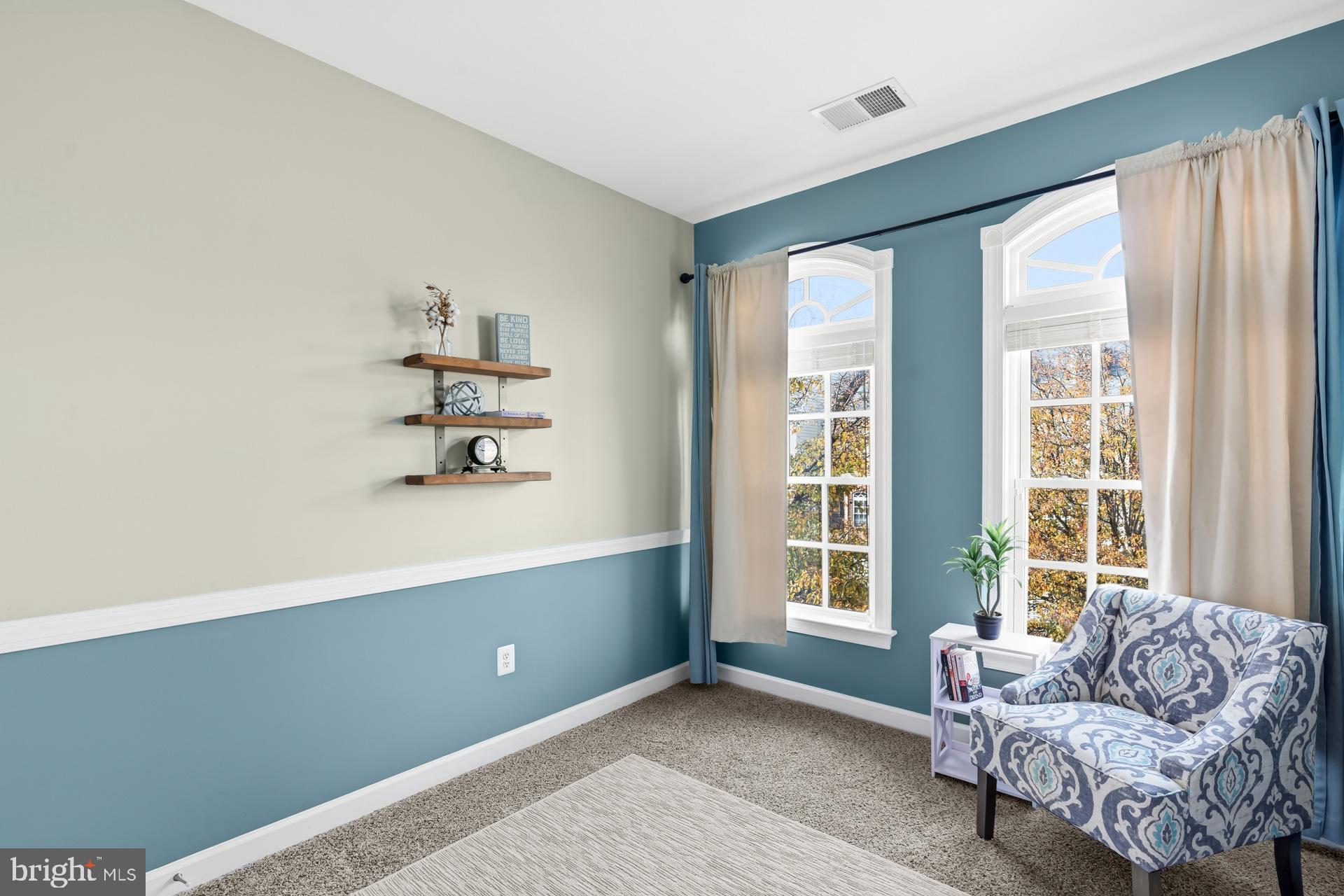10423 Rifle Road Bristow, VA 20136 - Photo 17 of 39 a living room with furniture and a window