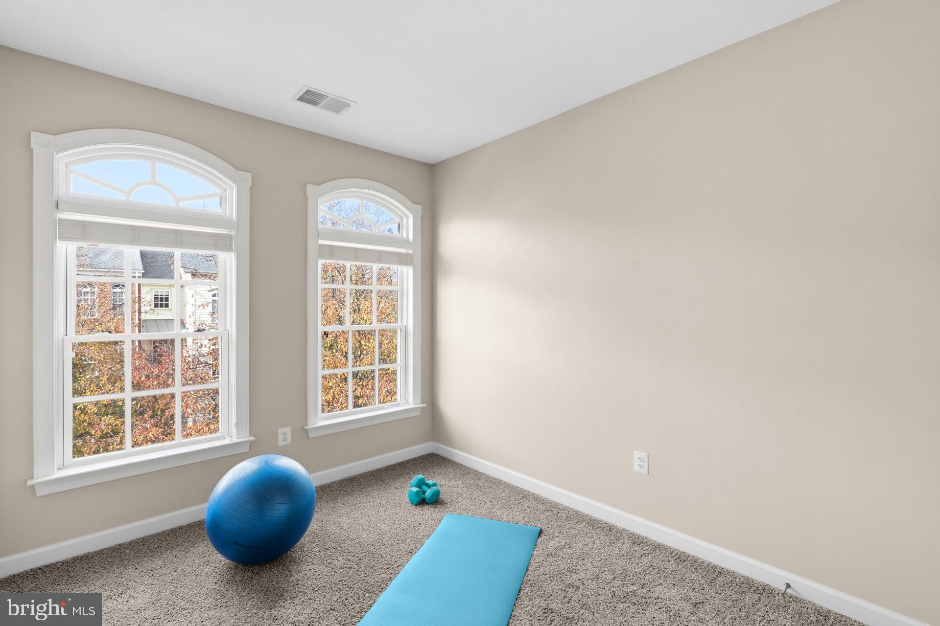 10423 Rifle Road Bristow, VA 20136 - Photo 19 of 39 a view of a bedroom with windows