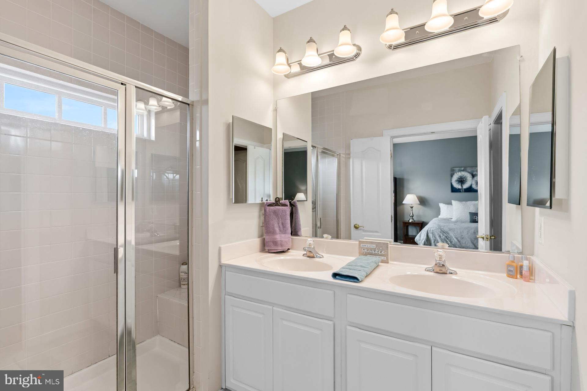 10423 Rifle Road Bristow, VA 20136 - Photo 26 of 39 a bathroom with a sink double vanity and a mirror