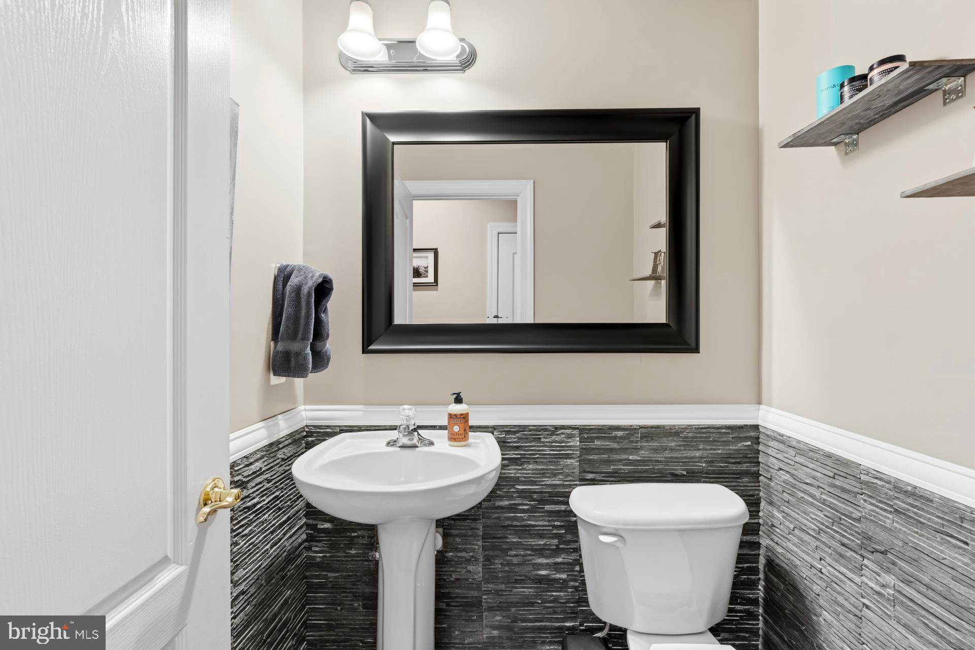 10423 Rifle Road Bristow, VA 20136 - Photo 34 of 39 a bathroom with a toilet sink and mirror