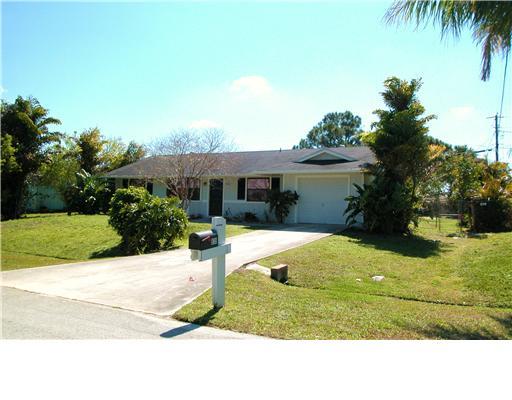 938 Southwest Bay State Road Port St. Lucie, FL 34953 - Photo 1 of 16 a view of backyard of the house