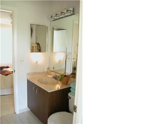 938 Southwest Bay State Road Port St. Lucie, FL 34953 - Photo 10 of 16 a bathroom with a sink and a mirror