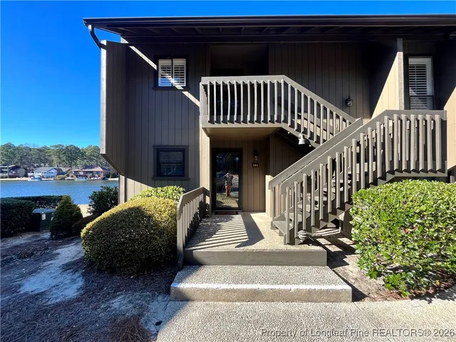 a view of a porch with furniture and garden