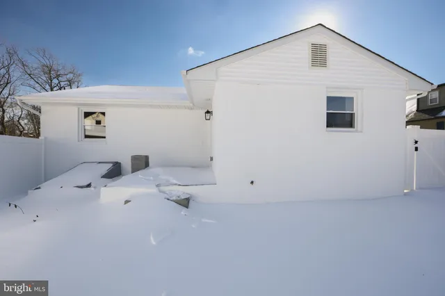 a view of a big room with painting on the wall