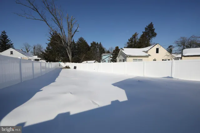 a view of a backyard of the house