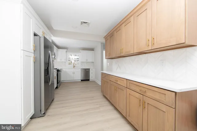 a view of a kitchen with cabinets