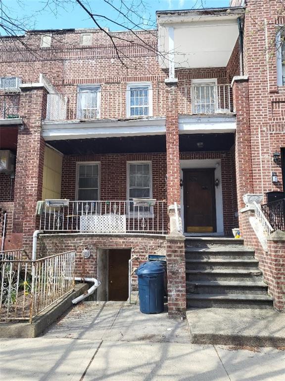 77 Webster Avenue Brooklyn, NY 11218 - Photo 1 of 6 a front view of a house with a porch