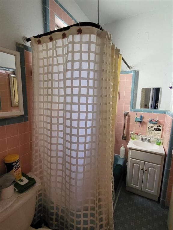 77 Webster Avenue Brooklyn, NY 11218 - Photo 5 of 6 a bathroom with a sink toilet and shower