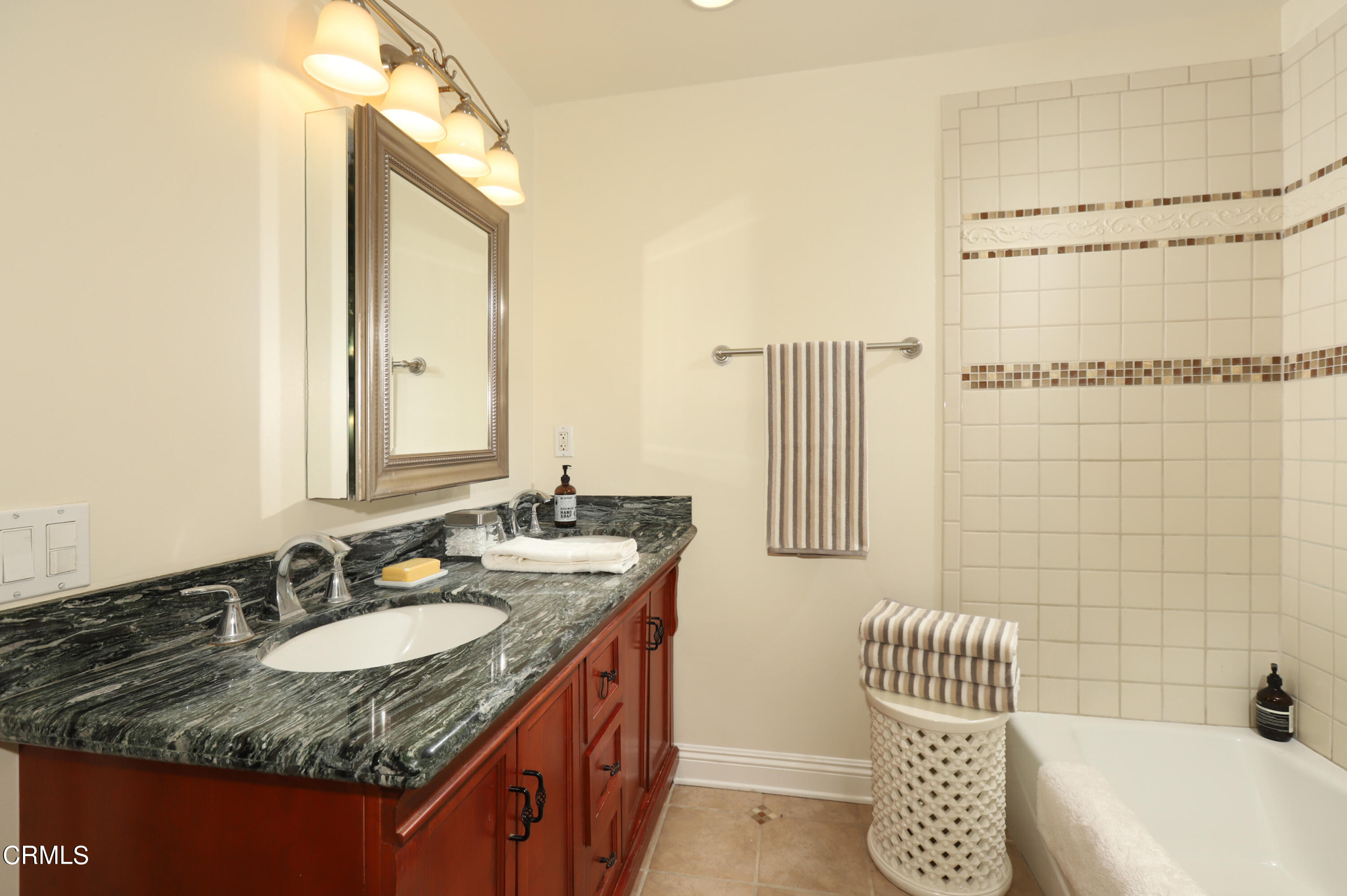 1062 Morada Place Altadena, CA 91001 - Photo 13 of 24 a bathroom with a granite countertop sink and a mirror