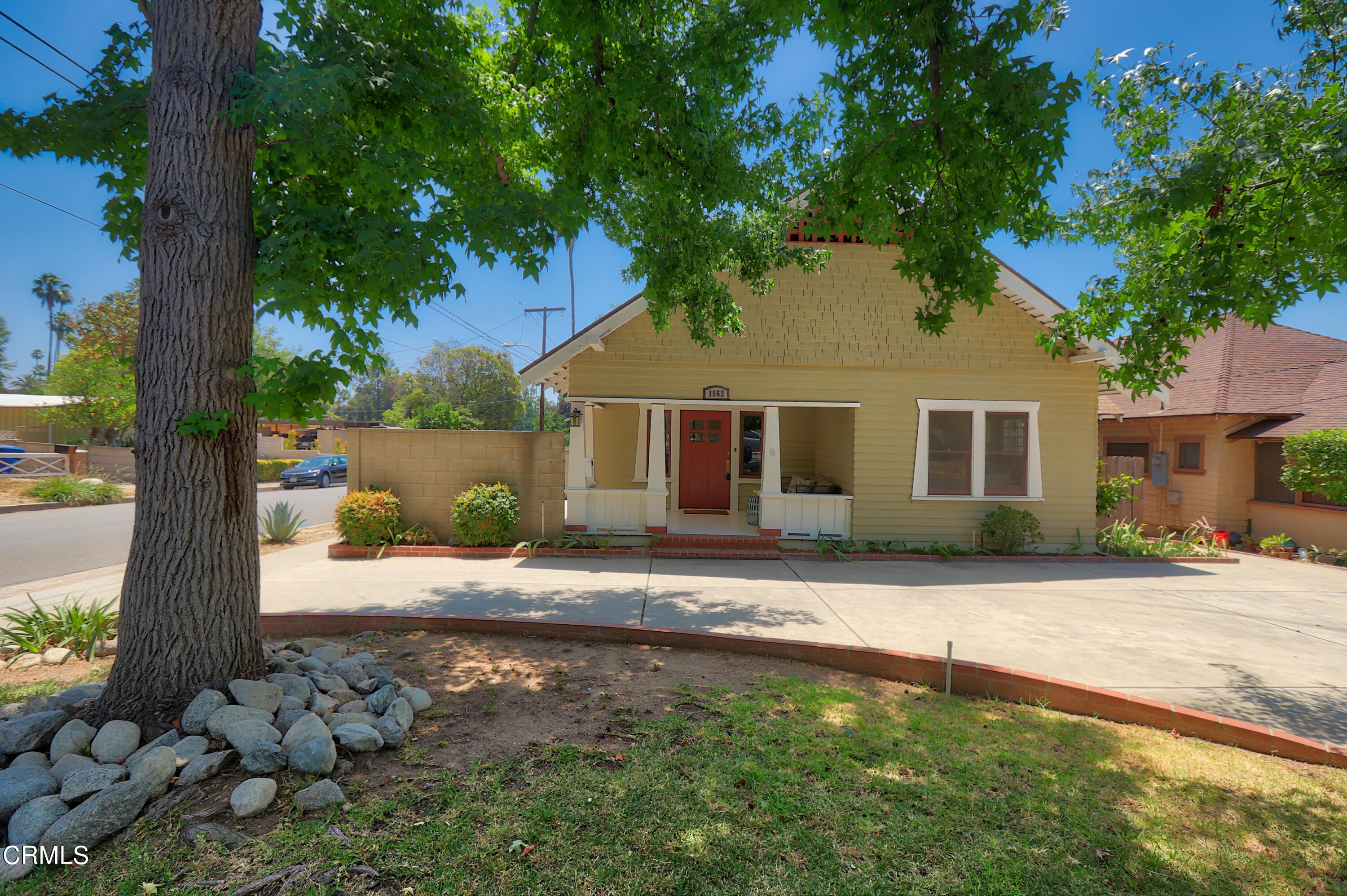 1062 Morada Place Altadena, CA 91001 - Photo 2 of 24 a front view of a house with a tree in a yard