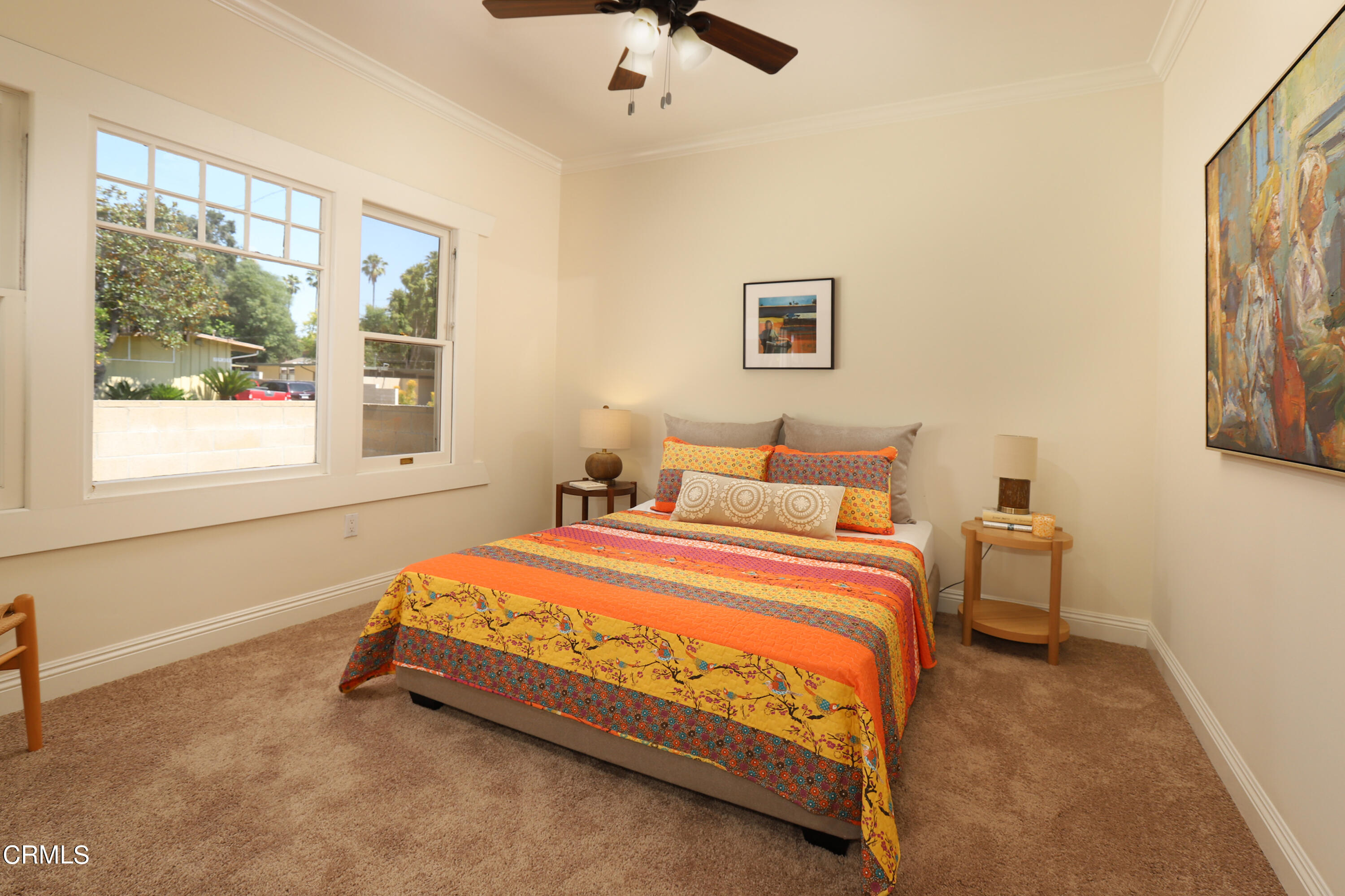 1062 Morada Place Altadena, CA 91001 - Photo 9 of 24 a bedroom with a bed and painting on the wall