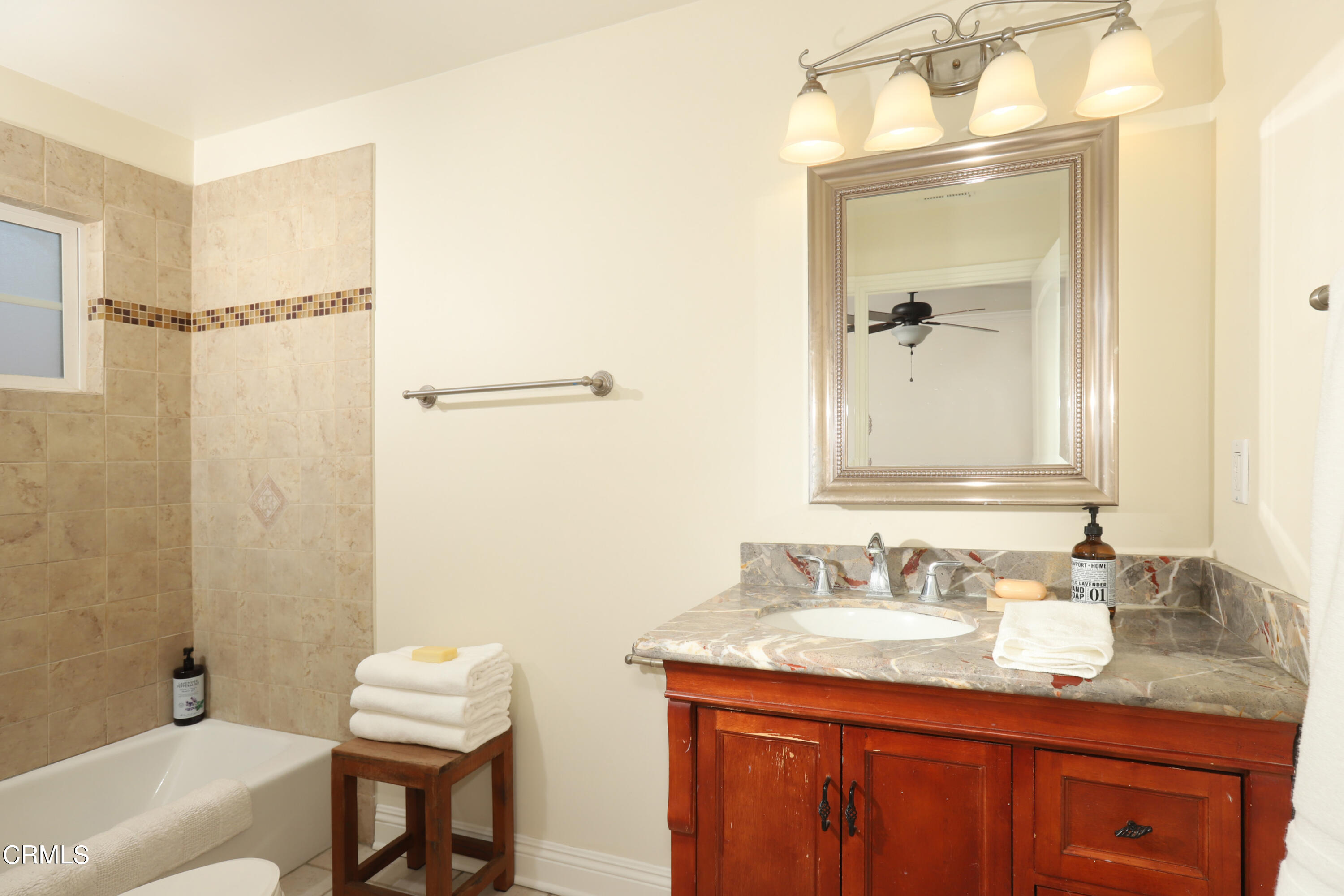 1062 Morada Place Altadena, CA 91001 - Photo 10 of 24 a bathroom with a granite countertop sink and a mirror