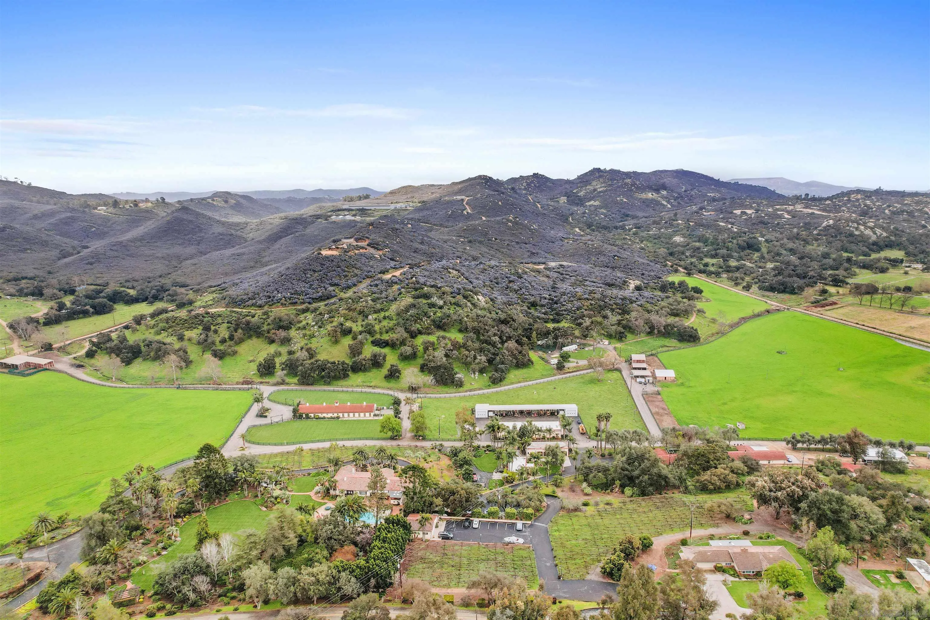 16757 Old Guejito Grade Road Escondido, CA 92027 - Photo 35 of 38 a view of a lush green hillside and houses