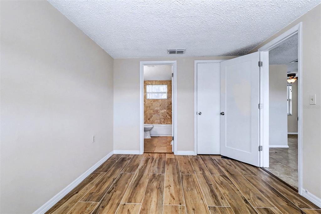 5441 Oceanic Road Holiday, FL 34690 - Photo 11 of 13 a view of a room with wooden floor and bench