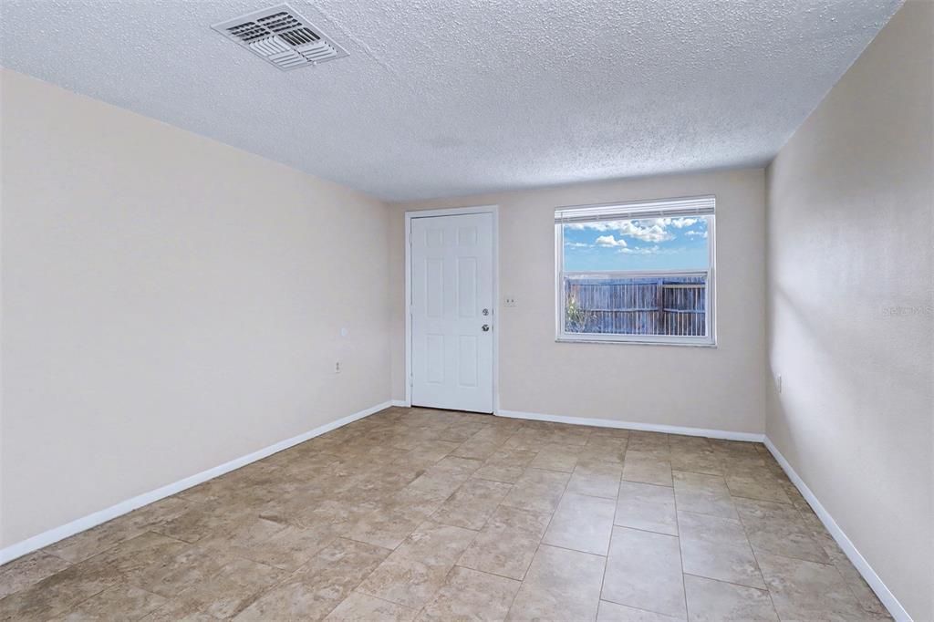 5441 Oceanic Road Holiday, FL 34690 - Photo 3 of 13 an empty room with windows