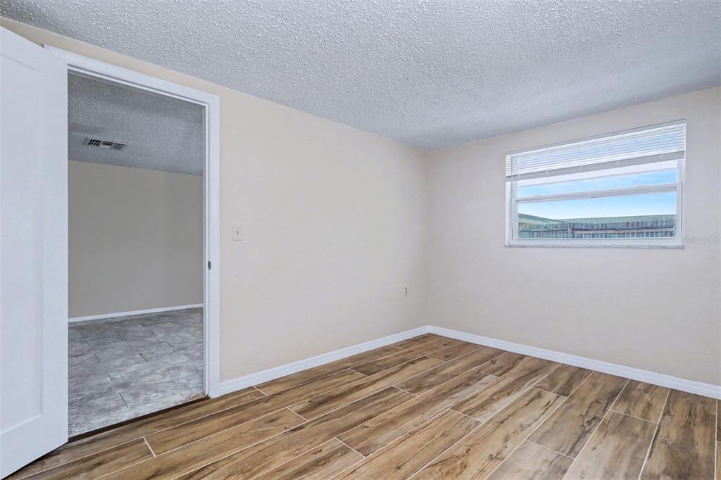 5441 Oceanic Road Holiday, FL 34690 - Photo 10 of 13 a view of empty room with wooden floor