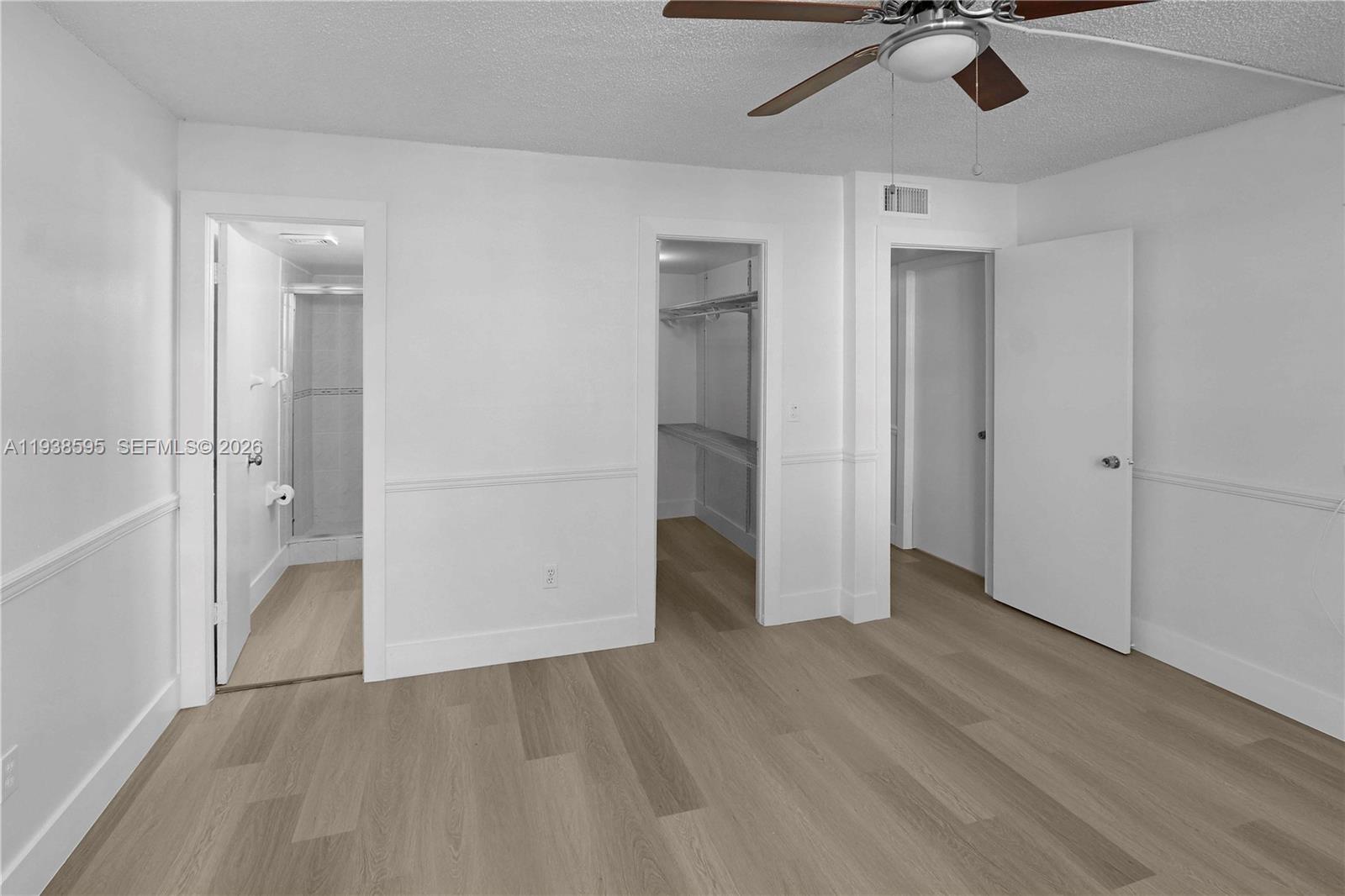 8309 Southwest 142nd Avenue, Unit G112 Miami, FL 33183 - Photo 12 of 28 wooden floor in an empty room