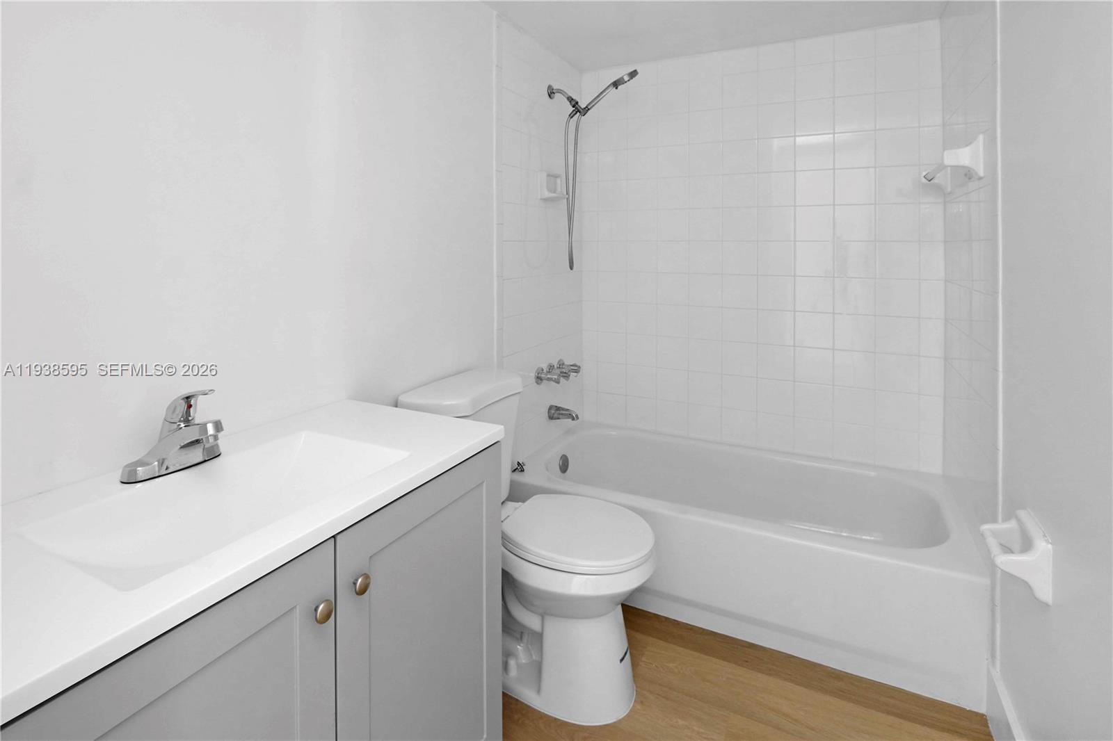 8309 Southwest 142nd Avenue, Unit G112 Miami, FL 33183 - Photo 9 of 28 a bathroom with a sink toilet and shower