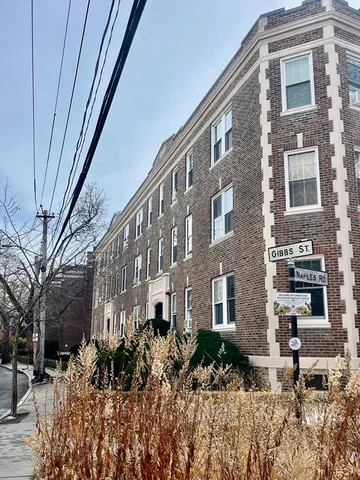 a front view of a building with garden