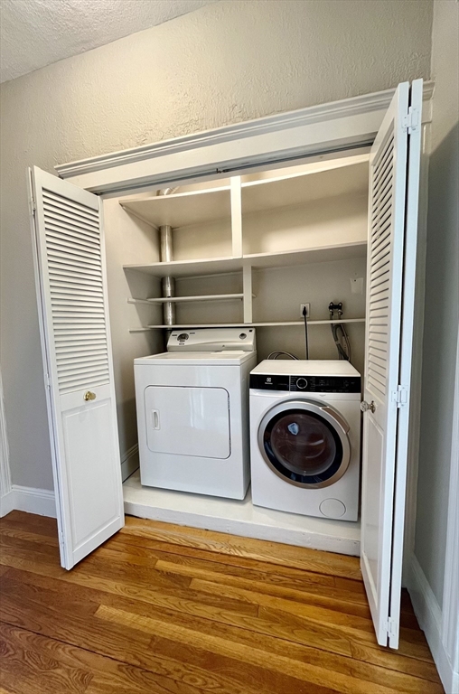 26 Gibbs Street, Unit 5 Brookline, MA 02446 - Photo 10 of 14 a utility room with washer and dryer