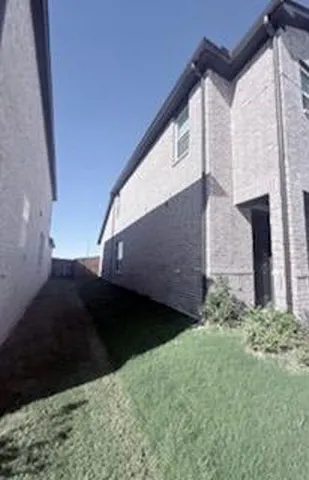 a view of a back yard of the house