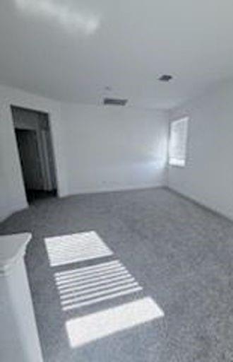 733 Santa Lucia Drive Anna, TX 75409 - Photo 10 of 13 a view of wooden floor and windows in a room
