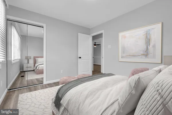 a bedroom with a bed and closet