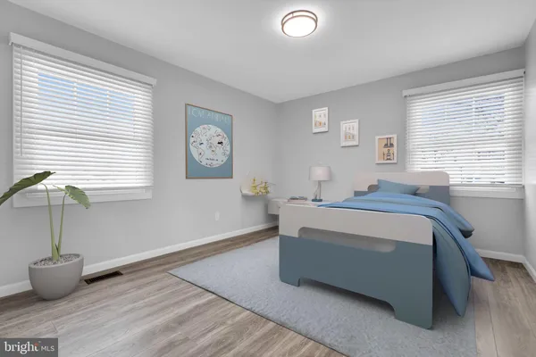 a bedroom with bed and window