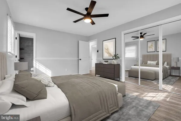 a bedroom with a bed and a couch