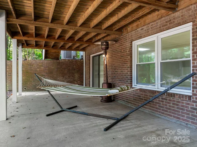 a view of house with backyard
