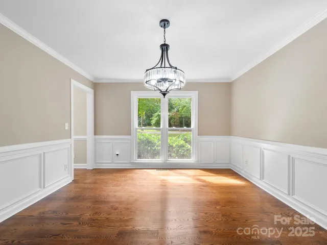 a view of a room with large windows