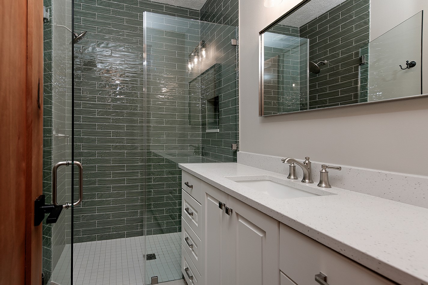 26442 McDonald Road Spring, TX 77380 - Photo 34 of 50 Bath 3 is beautifully finished with custom cabinets, quartz counters, custom shower and new lighting/plumbing fixtures.