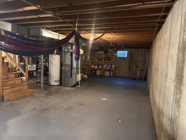 a view of empty room with wooden ceiling