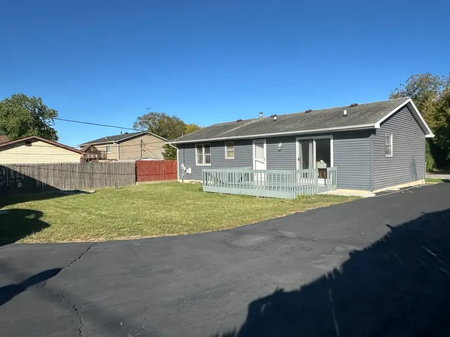 a view of house with outdoor space and swimming pool