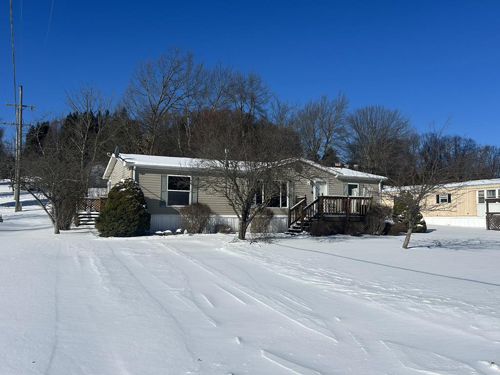 321 Ridge Avenue Avenue Strattanville, PA 16258 - Photo 1 of 29 a front view of a house with a yard and trees