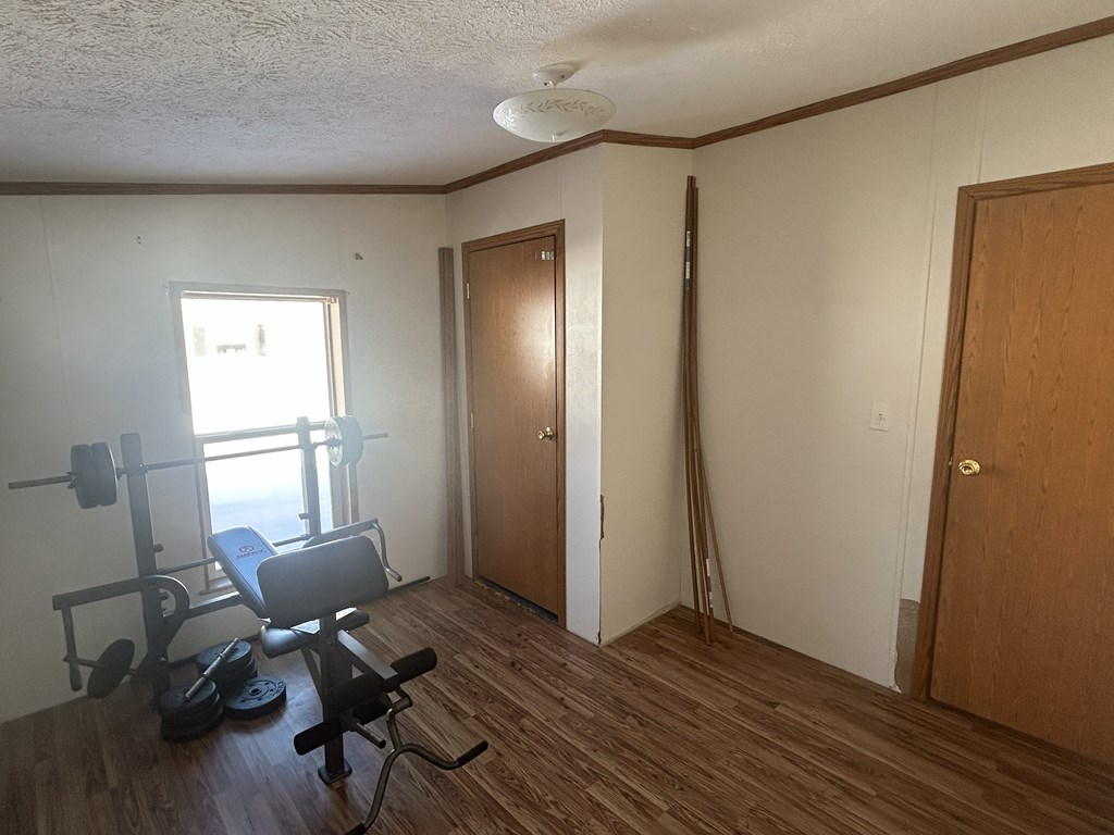 321 Ridge Avenue Avenue Strattanville, PA 16258 - Photo 13 of 29 a view of a workspace with wooden floor and a window