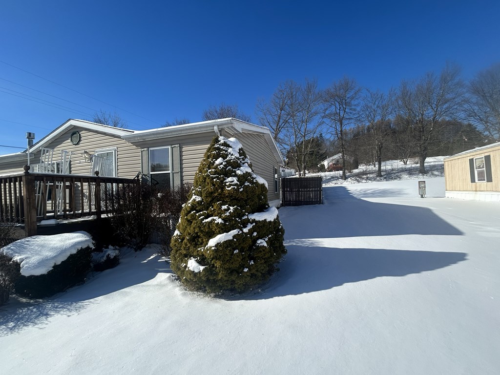 321 Ridge Avenue Avenue Strattanville, PA 16258 - Photo 29 of 29 a view of a porch with furniture and a yard
