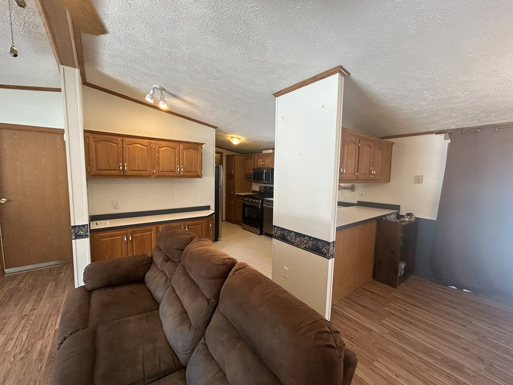 321 Ridge Avenue Avenue Strattanville, PA 16258 - Photo 7 of 29 a living room with stainless steel appliances furniture and a kitchen view