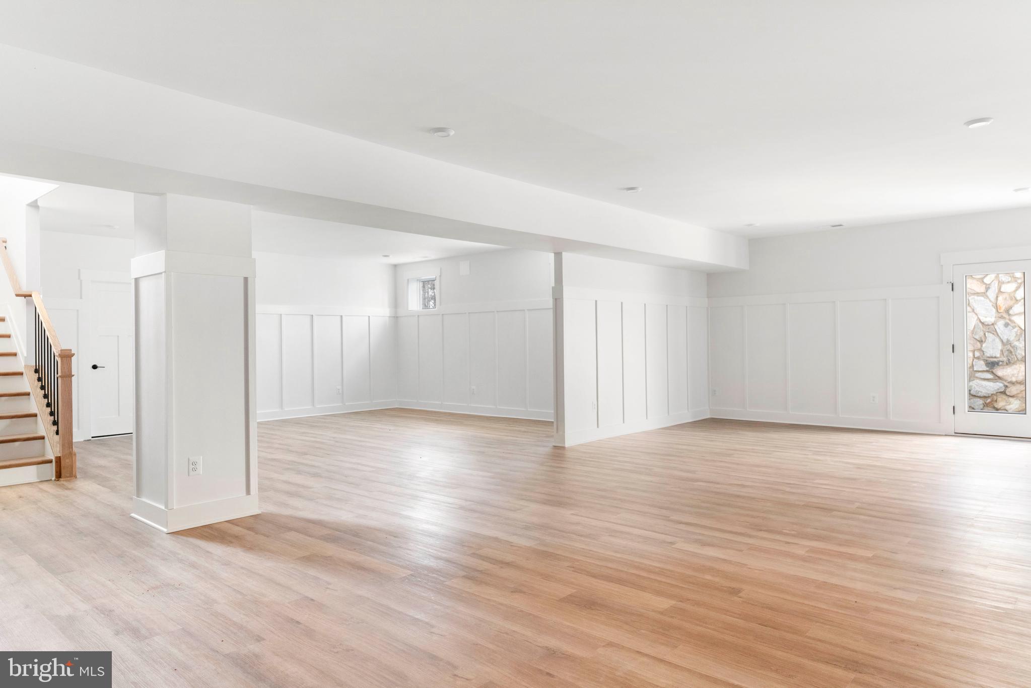 3321 Patuxent River Road Davidsonville, MD 21035 - Photo 56 of 81 a view of an empty room with wooden floor and a window