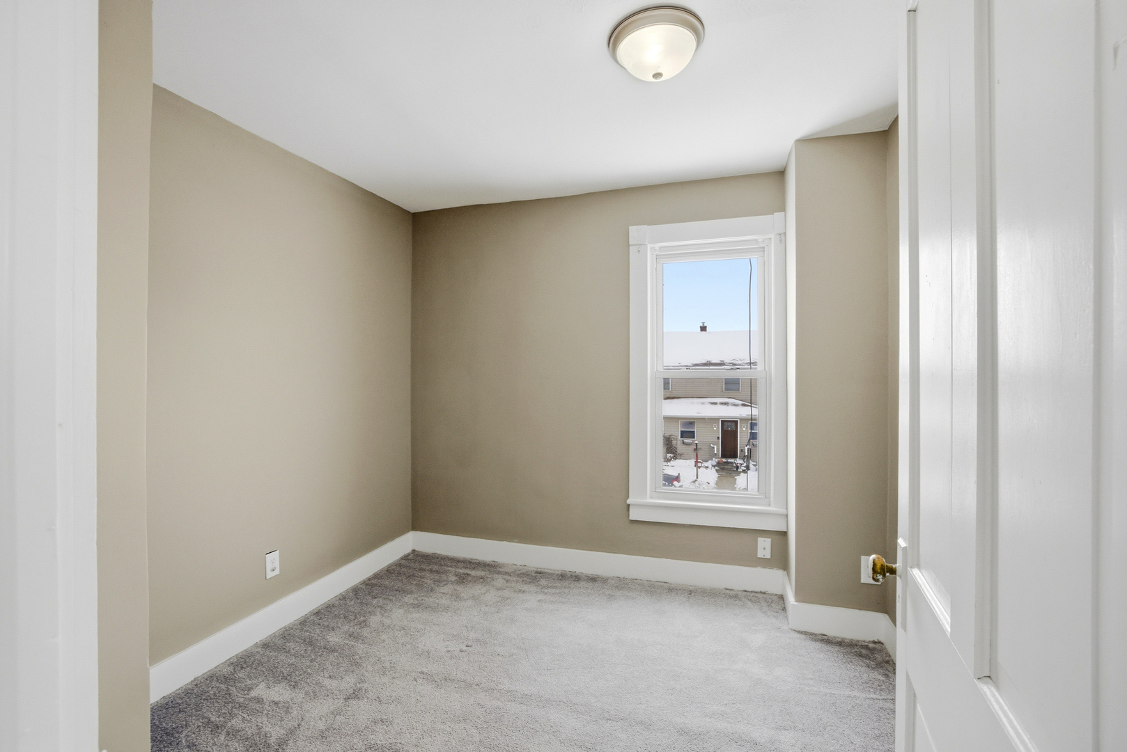 406 West Balsam Street Forreston, IL 61030 - Photo 27 of 36 a view of an empty room and a window