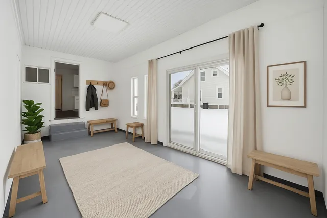 a living room with furniture and a gate