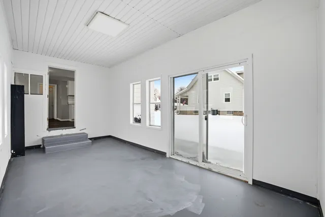 an empty room with windows