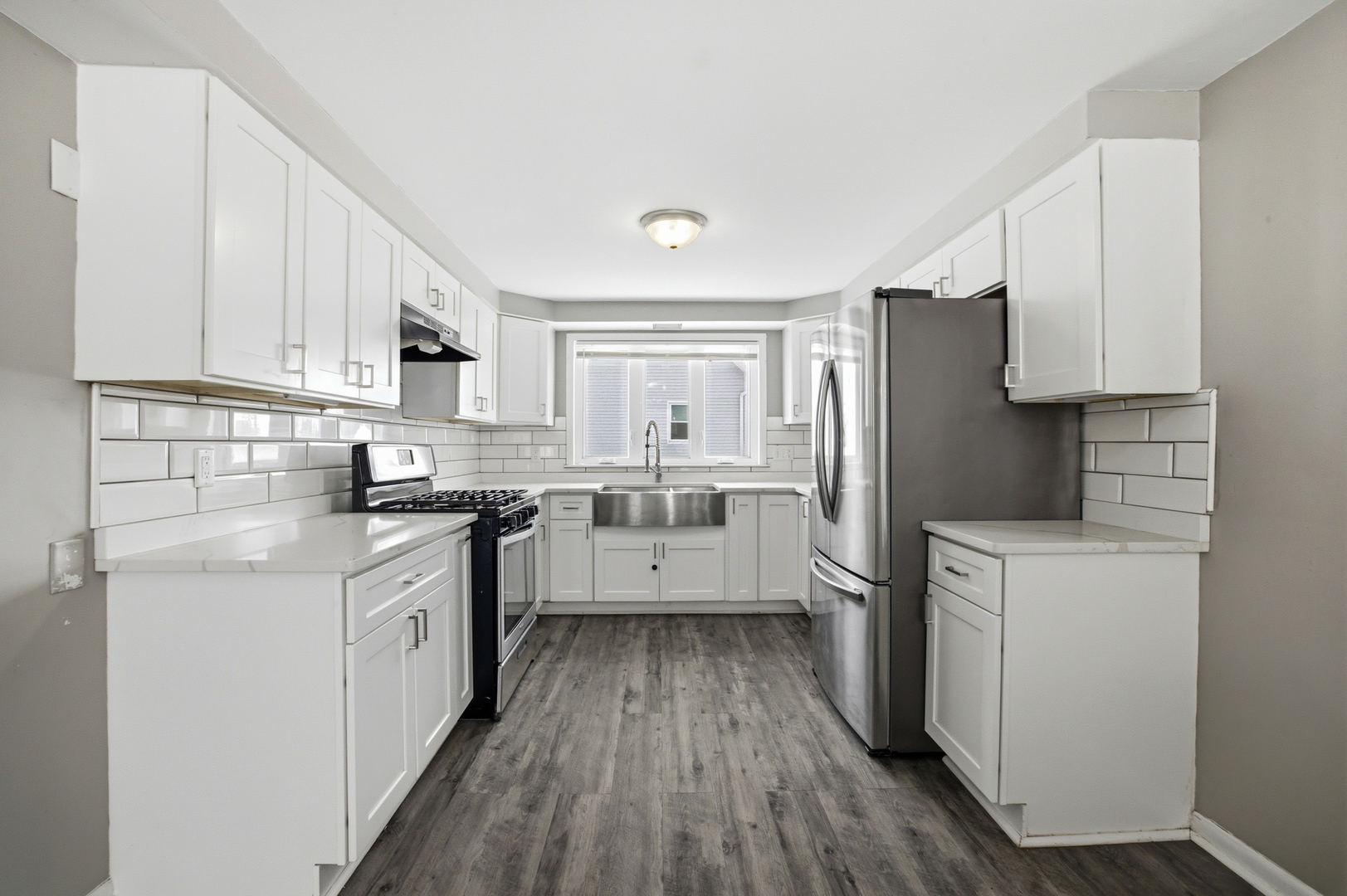406 West Balsam Street Forreston, IL 61030 - Photo 8 of 36 a kitchen with white cabinets and stainless steel appliances