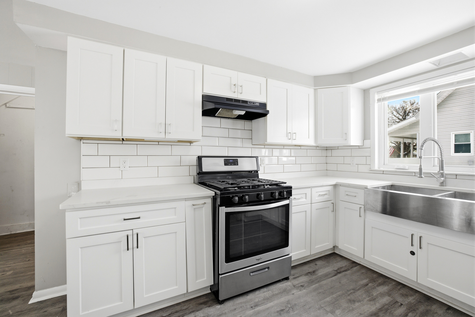 406 West Balsam Street Forreston, IL 61030 - Photo 9 of 36 a kitchen with white cabinets and appliances
