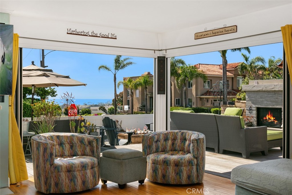 24272 Selva Road Dana Point, CA 92629 - Photo 13 of 39 a living room with furniture and a large window