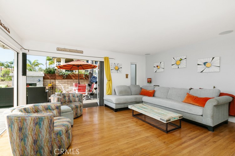 24272 Selva Road Dana Point, CA 92629 - Photo 14 of 39 a living room with furniture and a wooden floor