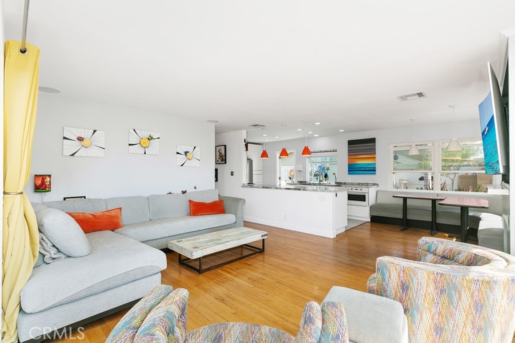 24272 Selva Road Dana Point, CA 92629 - Photo 15 of 39 a living room with furniture kitchen view and a large window