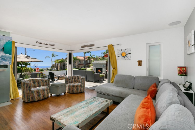 24272 Selva Road Dana Point, CA 92629 - Photo 16 of 39 a living room with furniture and a couch
