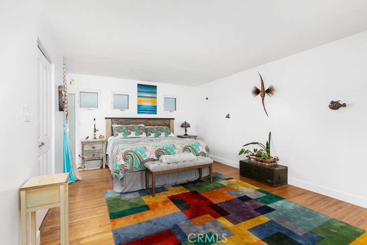 24272 Selva Road Dana Point, CA 92629 - Photo 23 of 39 a living room with furniture and a baby crib