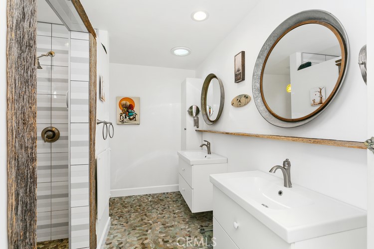 24272 Selva Road Dana Point, CA 92629 - Photo 25 of 39 a bathroom with a sink and a mirror